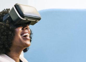 Lady sitting on a chair using Virtual Reality helmet