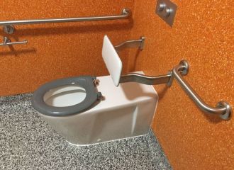 An accessible toilet pan with grabrails and a backrest
