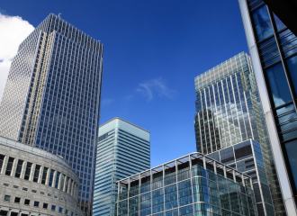 Modern skyscraper office buildings against a blue skyline