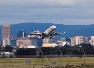 Adelaide airport with a Virgin plane taking off